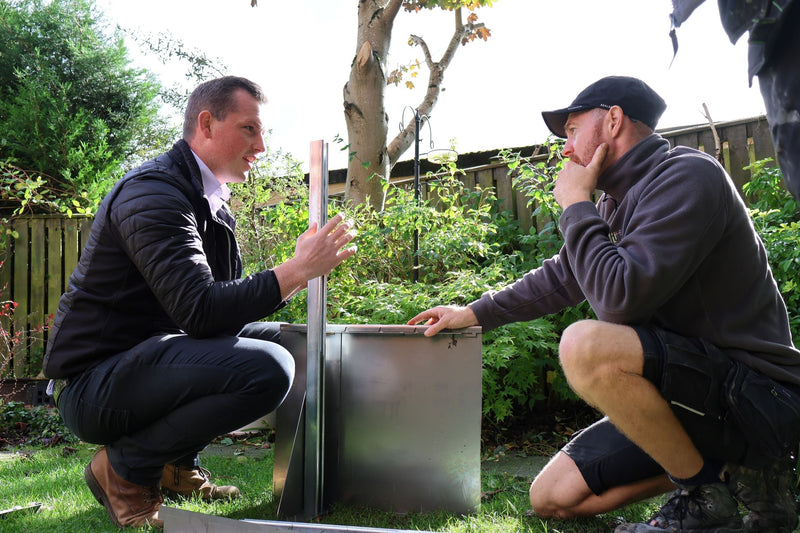 GEO Contour steel raised garden bed being installed by landscapers in a residential garden