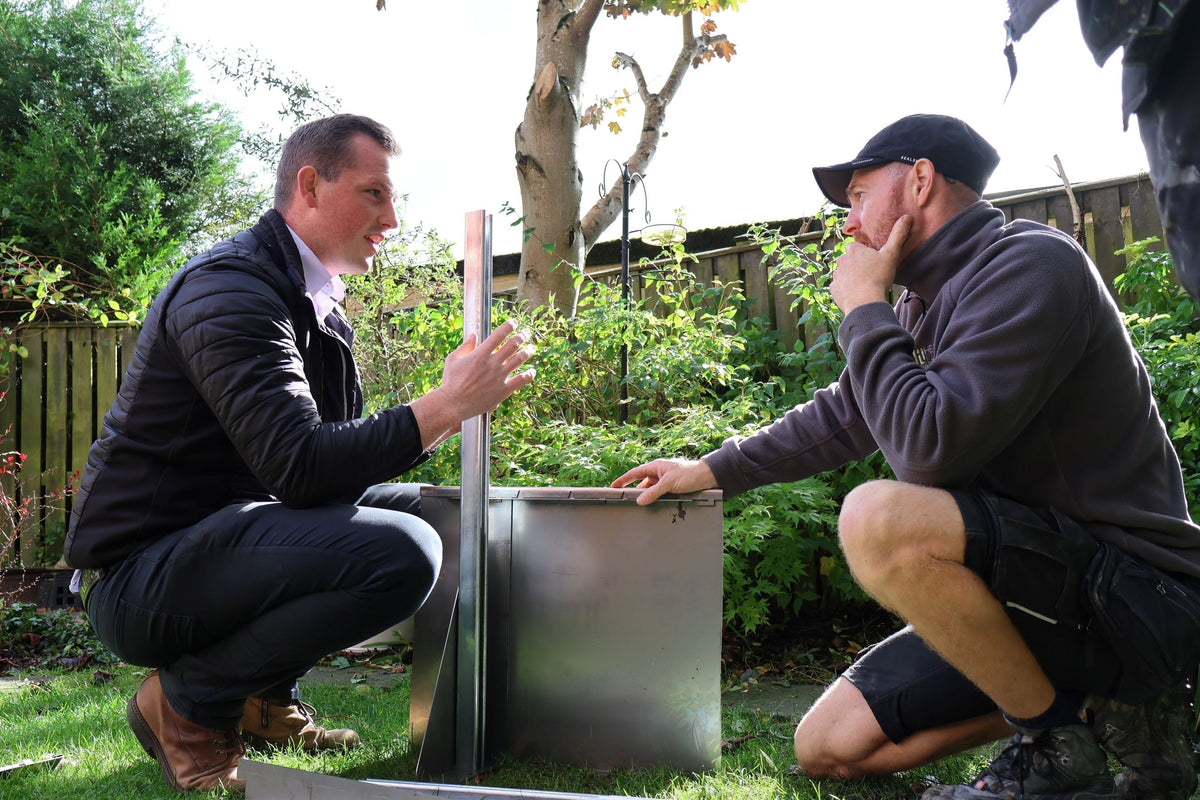 GEO Contour steel raised garden bed being installed by landscapers in a residential garden