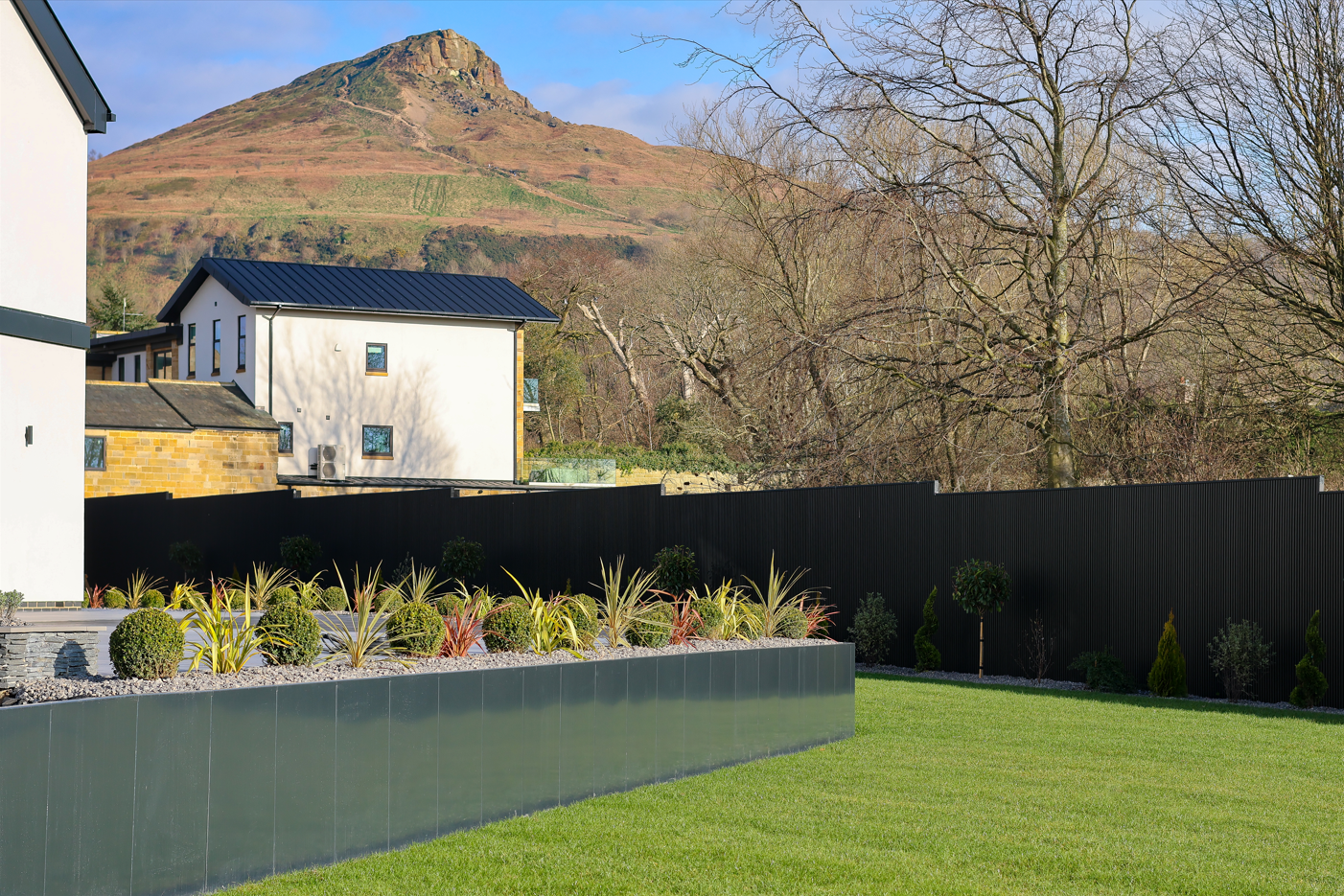 Contemporary garden inspired by Roseberry Topping featuring Anco Retaining Wall steel garden edging and naturalistic planting.