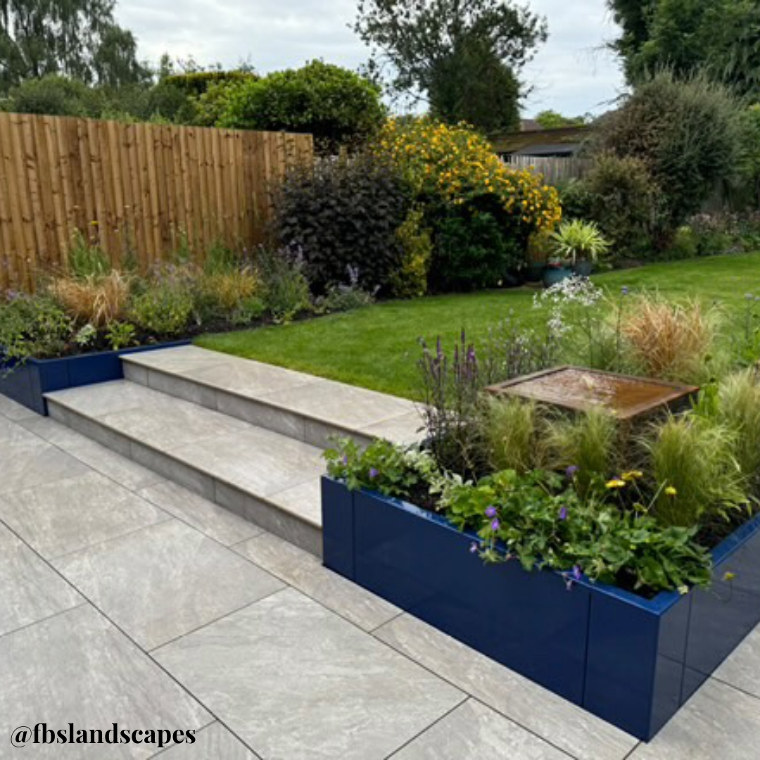 Cobalt Blue Powder coated steel Anco retaining wall planters in garden border for zoning