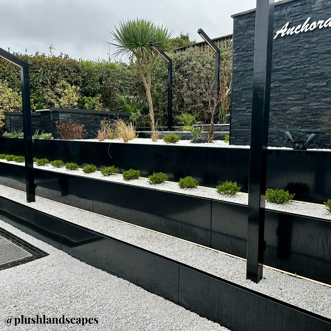 Garden terracing black planter edge- Anco reatining wall in black powder caoting creating a 3 level stepped tiered garden.