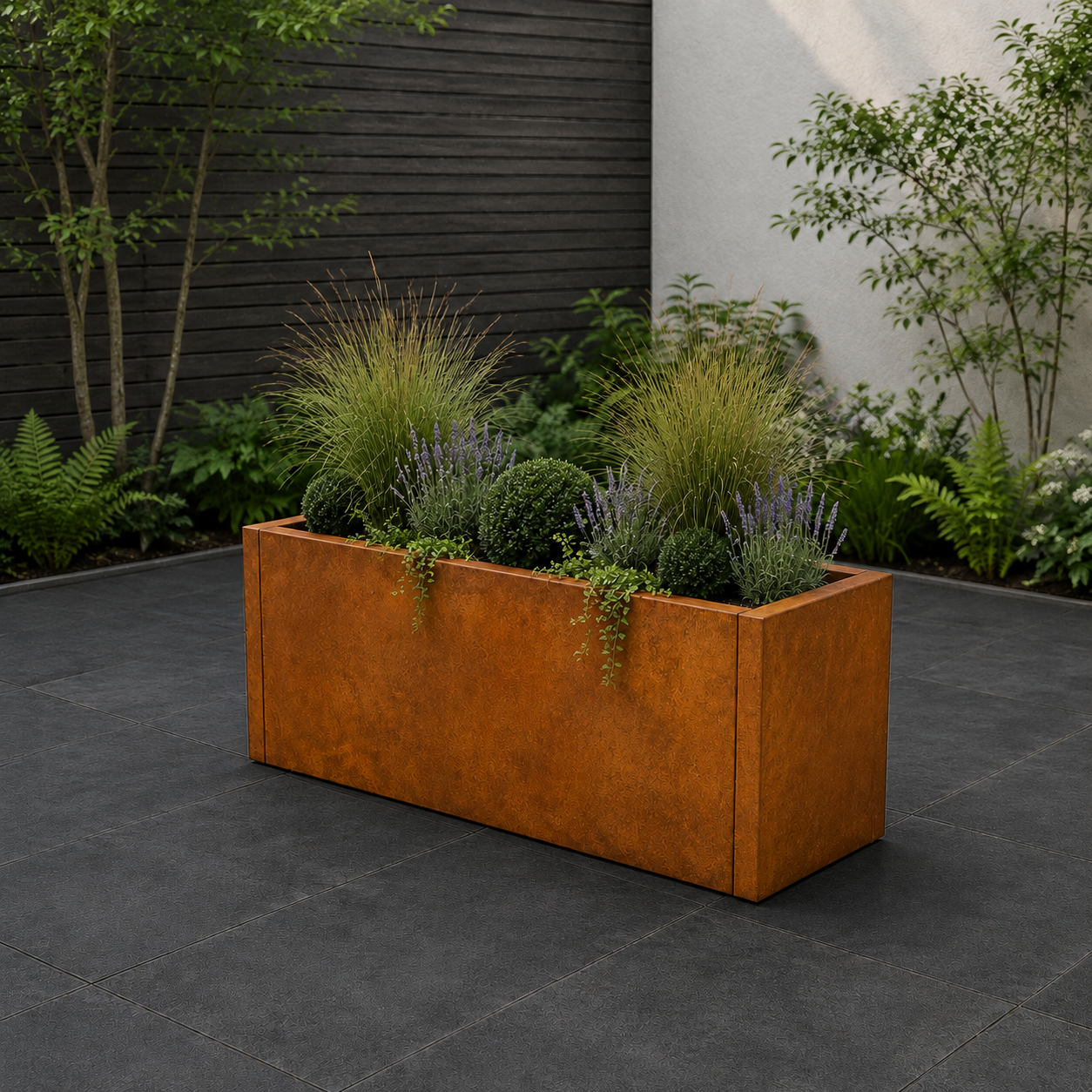 Corten steel garden planter tub, with dark paving and modern fence