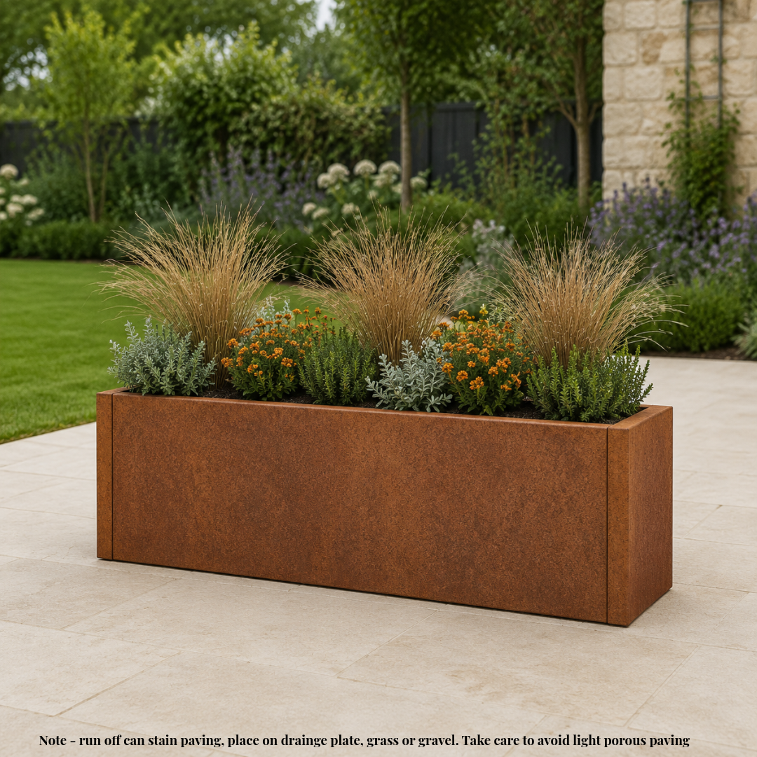Corten steel rusted planter tub in modern clean garden