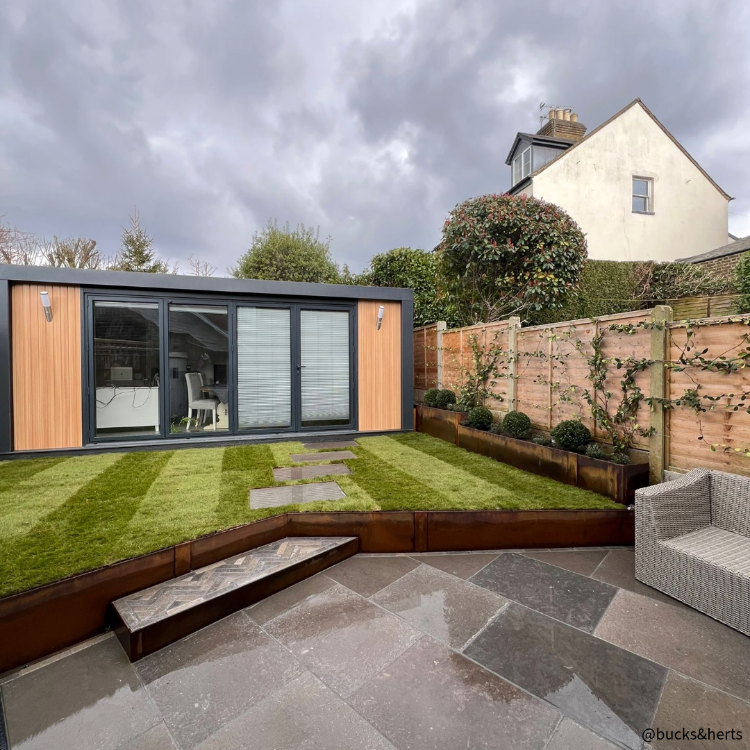 Contour Raised Bed System - Edge height 300mm High Corten Steel Garden Edging, creating boundary between soil, planting and gravel path. Lawn edge, garden border, flower beds, driveway raised edging. Metal, weathering steel, or powder coated steel.  Garden walkway, path and paving. Planter edge and retaining wall. Patio edge and garden walls.GardenEdgingOnline.com